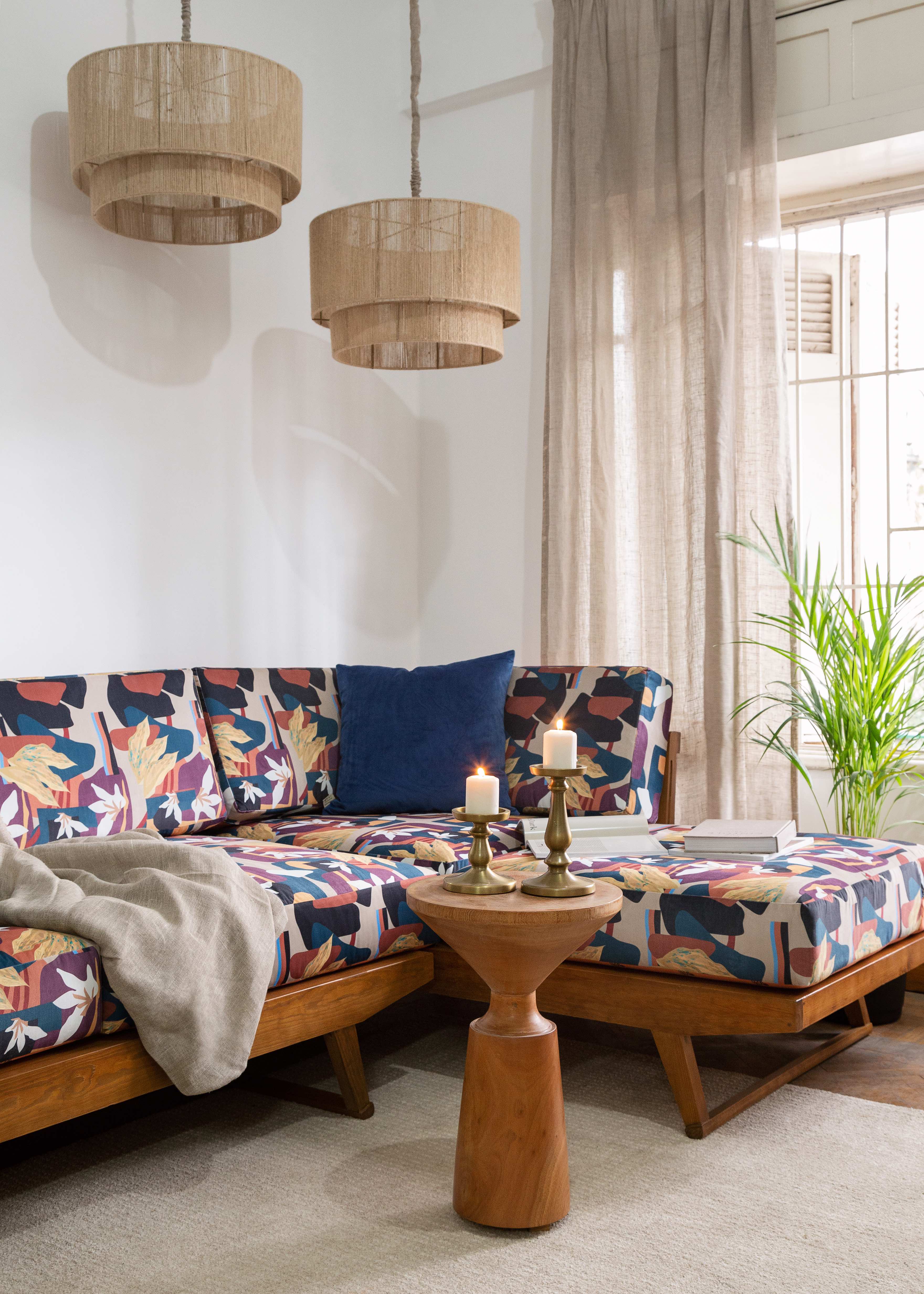 TWO chandeliers with a sofa placed in a living room for interior design 