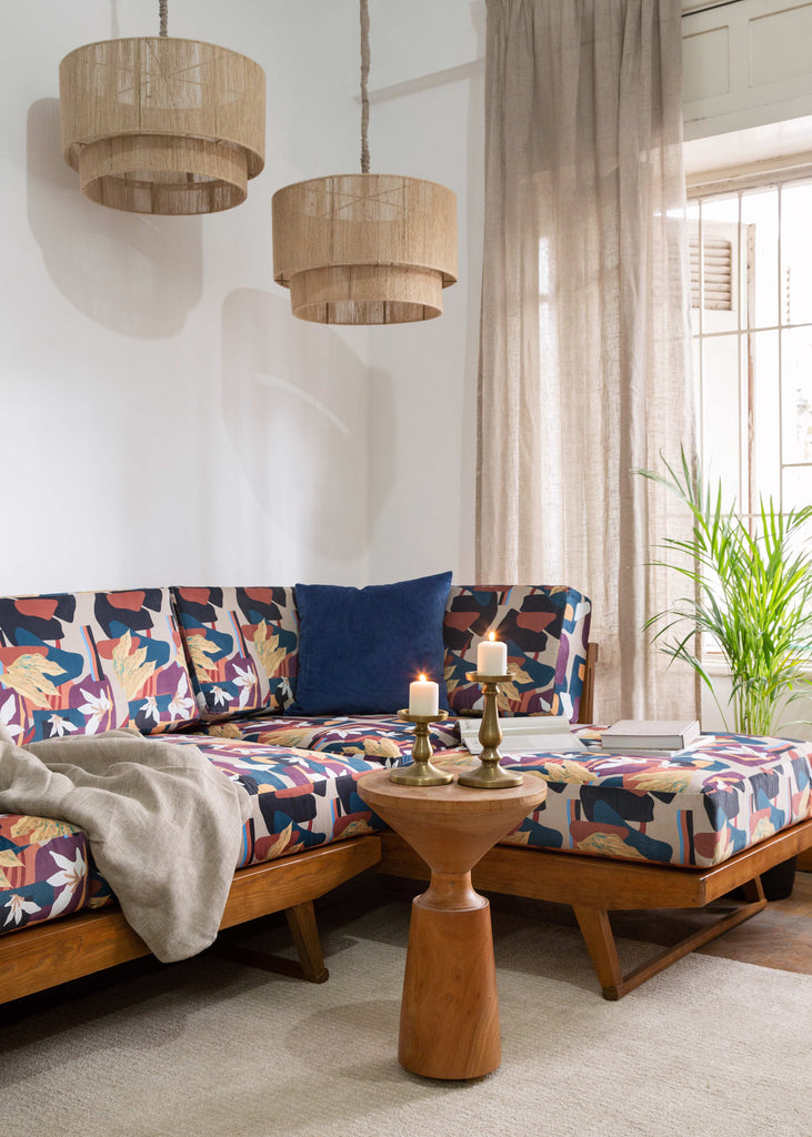 TWO chandeliers with a sofa placed in a living room for interior design 